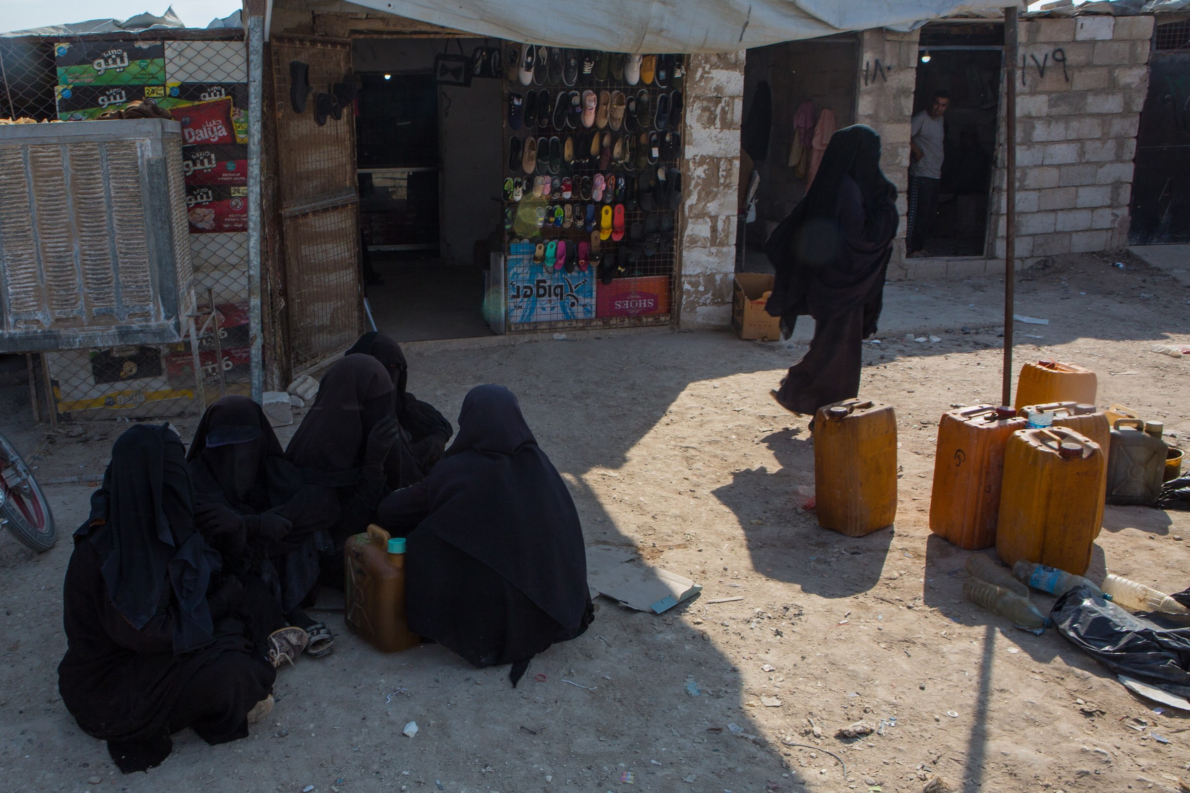 Women at a market inside the al-Hol detention camp in northeast Syria in October 2019 — Salman testified she spent five years in a Kurdish-run detention camp before her 2024 repatriation