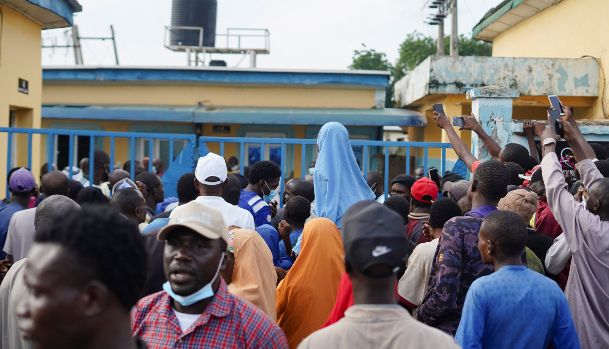 Relatives and community members gather outside General Hospital in Minna after detainees died in NSCDC custody