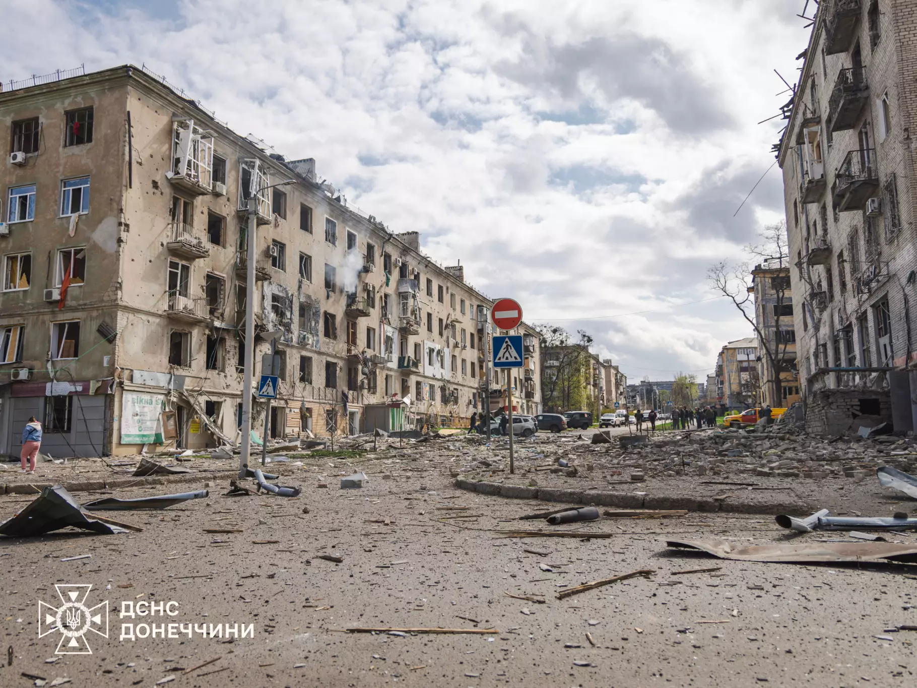 A debris-covered street between damaged apartment buildings in Kramatorsk — file photo from an earlier attack on the city