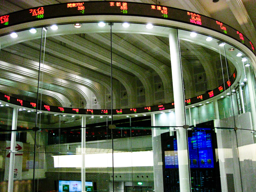 The market centre of the Tokyo Stock Exchange, its circular ticker ring lit with stock prices — file photo for Asian stocks sell off coverage