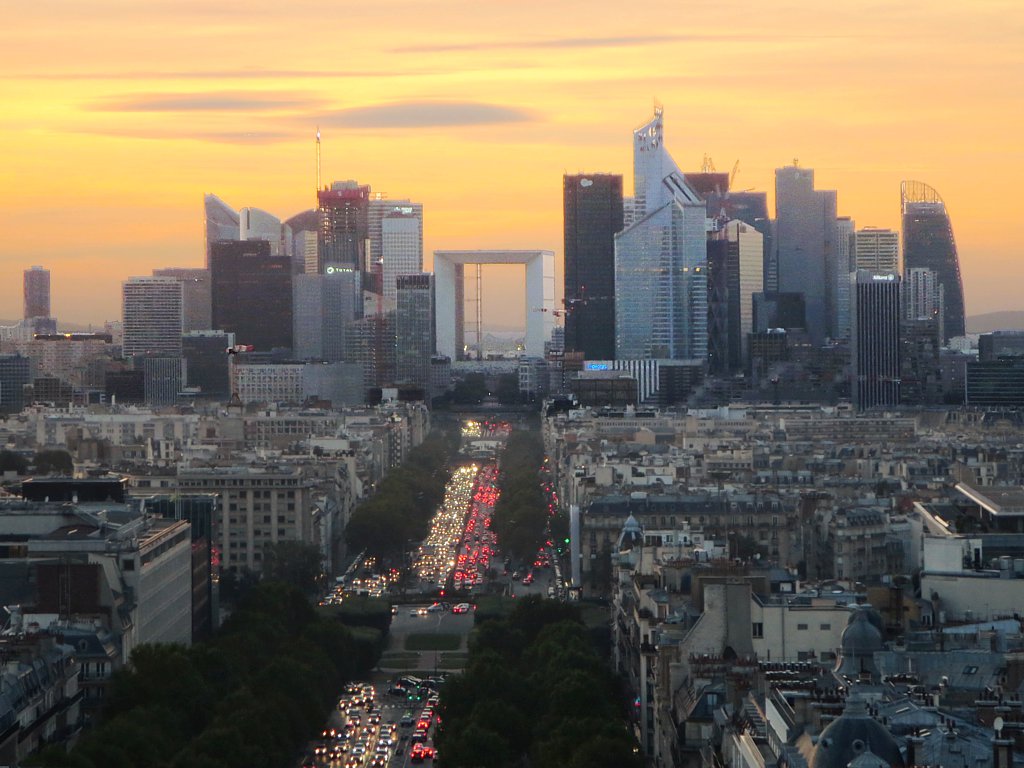 France PMI October 2026 — the La Défense business district of Paris at dusk, with the Grande Arche, as French business activity contracted in October