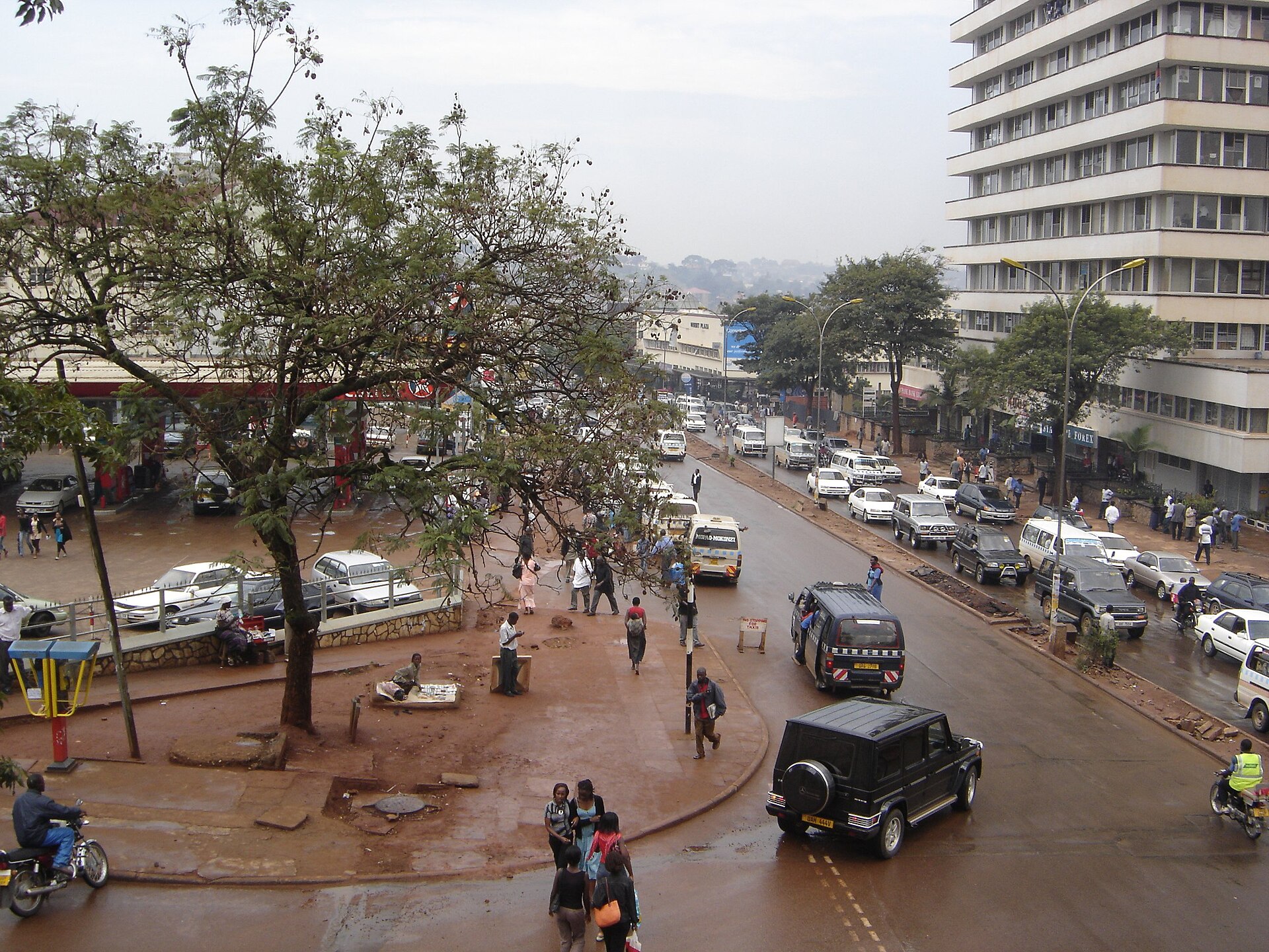 Downtown Kampala, Uganda, with traffic and pedestrians on a busy city street — the capital whose foreign ministry confirmed the embassy letter reporting 27 citizens killed or presumed dead fighting for Russia in Ukraine