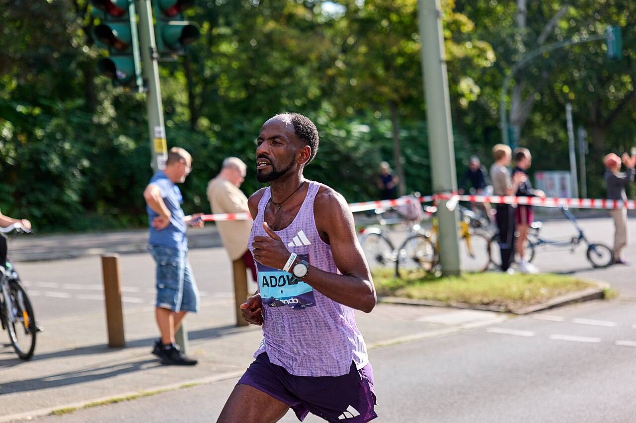 Guye Adola of Ethiopia running at the Berlin Marathon; he won the 2026 men's race in 2:02:50