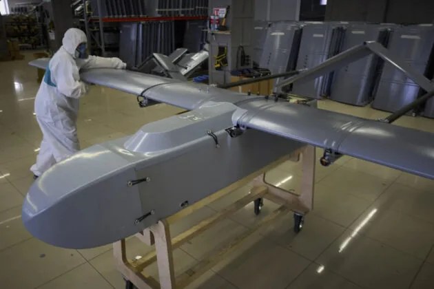 A long-range Fire Point drone on a production floor