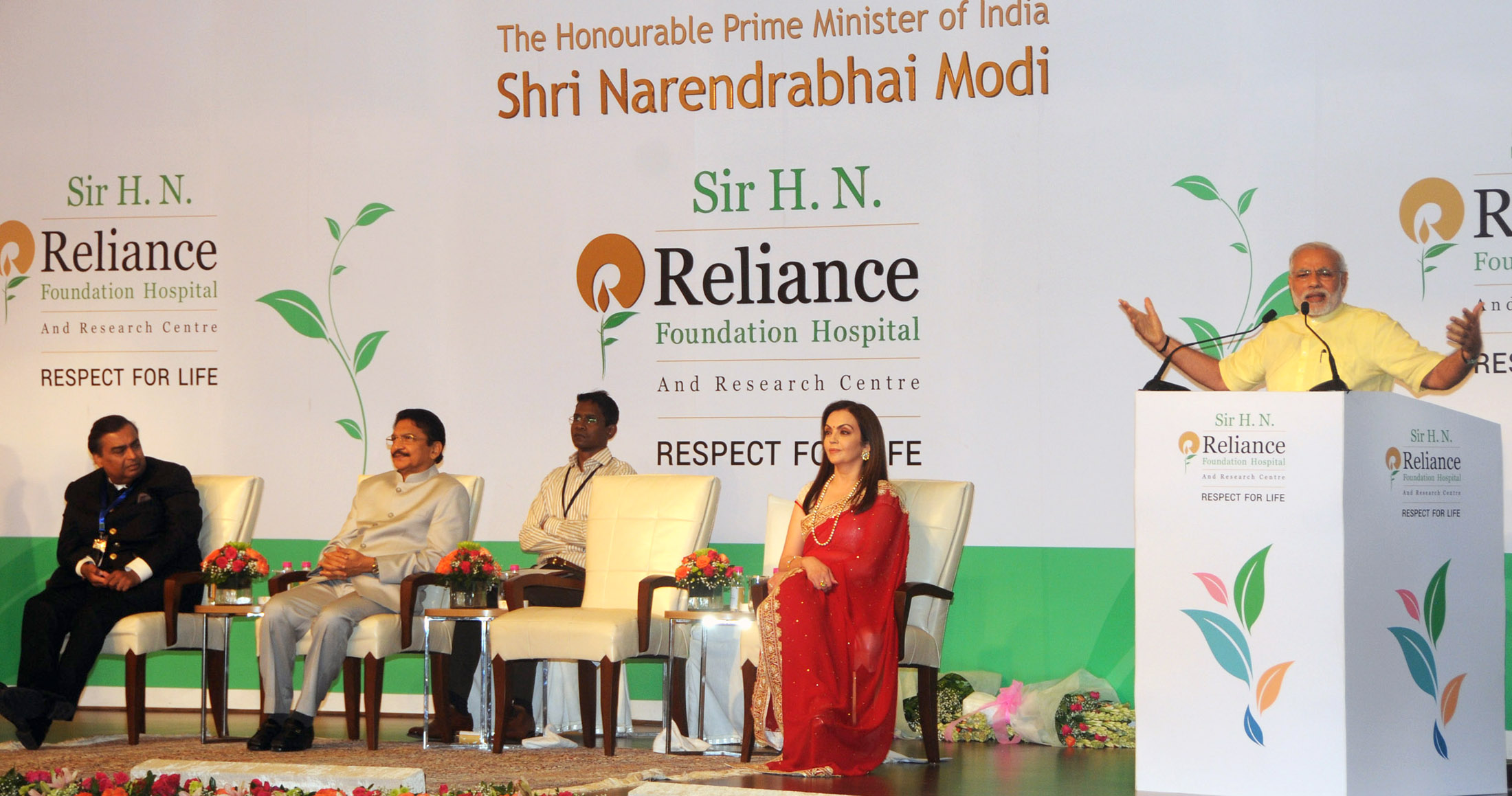 Mukesh Ambani seated at a Reliance Foundation event in Mumbai in 2014 as Prime Minister Narendra Modi speaks