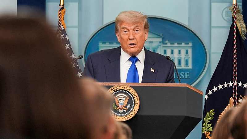 Donald Trump speaking at the White House during the Iran war