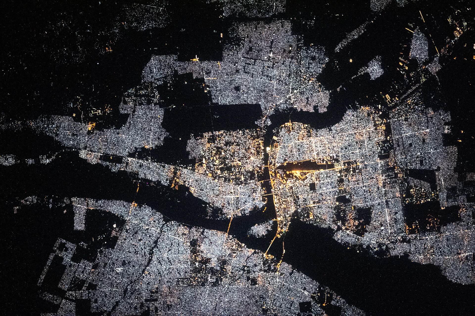 Khartoum at night photographed from the International Space Station, its lights spread along the Nile — parts of greater Khartoum lost power when a drone strike disabled the Al-Markhiyat transformer station on October 27, 2026