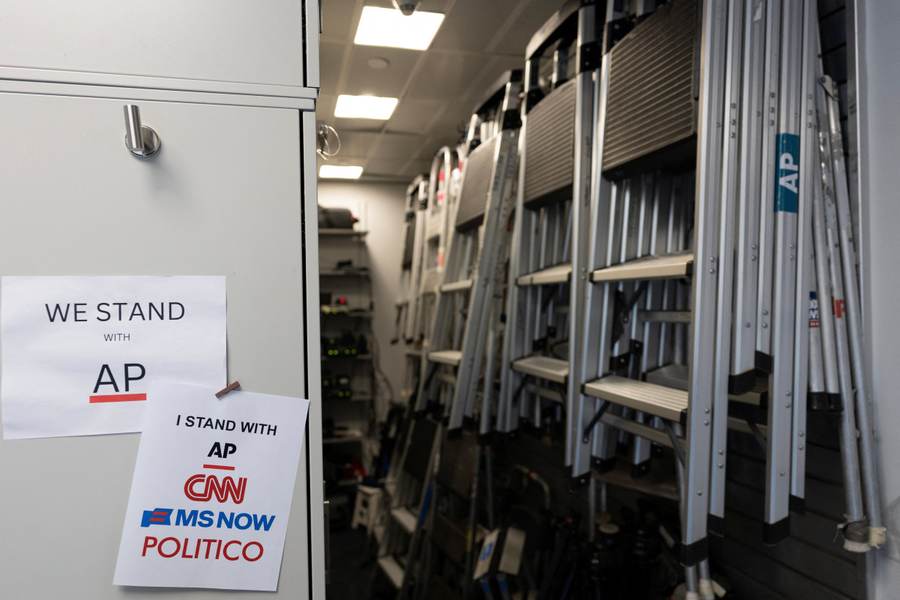 Signs supporting CNN, MS NOW and Politico at the White House during the White House press ban extension fight