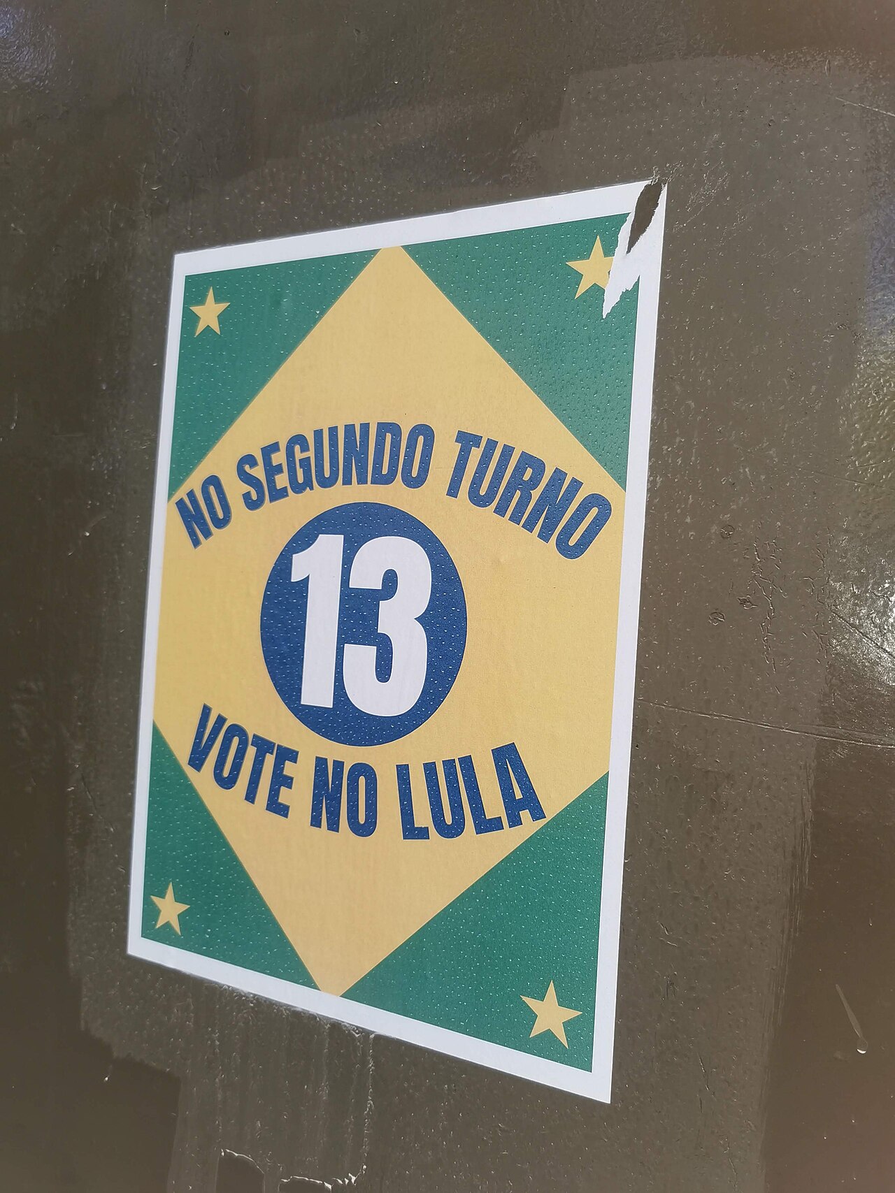 A runoff campaign poster in Barcelona urging Brazilians abroad to vote for Lula, ballot number 13, in Brazil's presidential second round