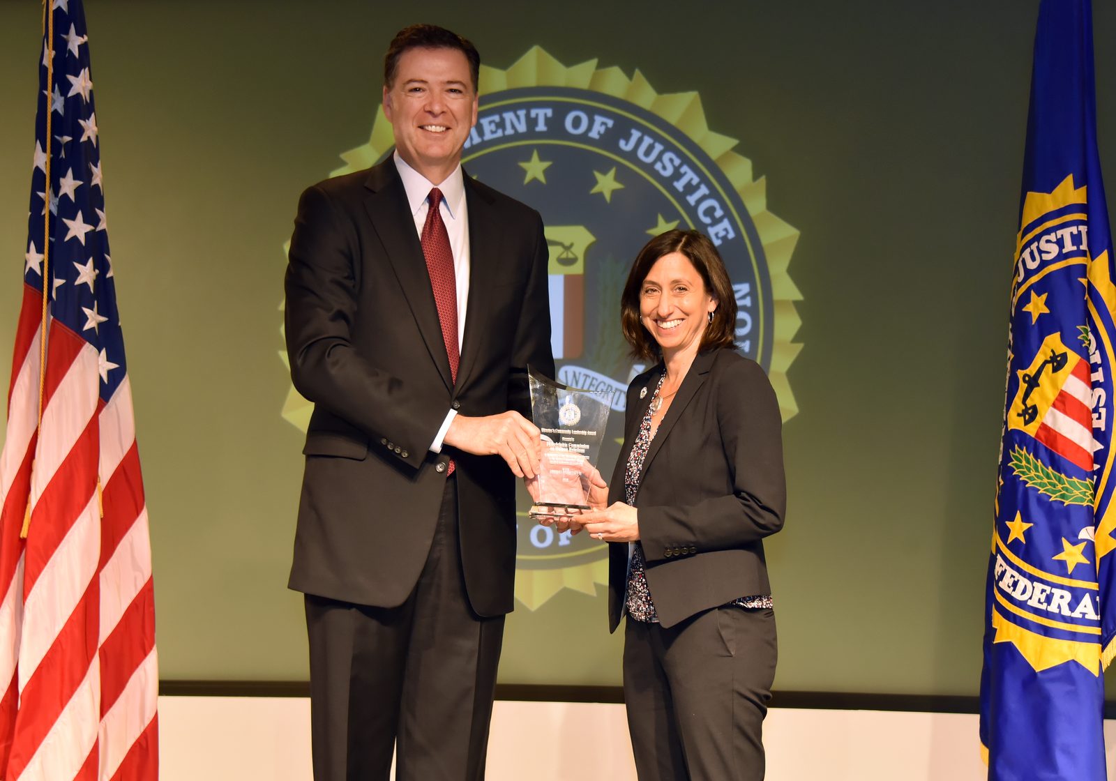 FBI Director James Comey presenting a community leadership award in 2016, the year of the alleged leak in the third Comey case