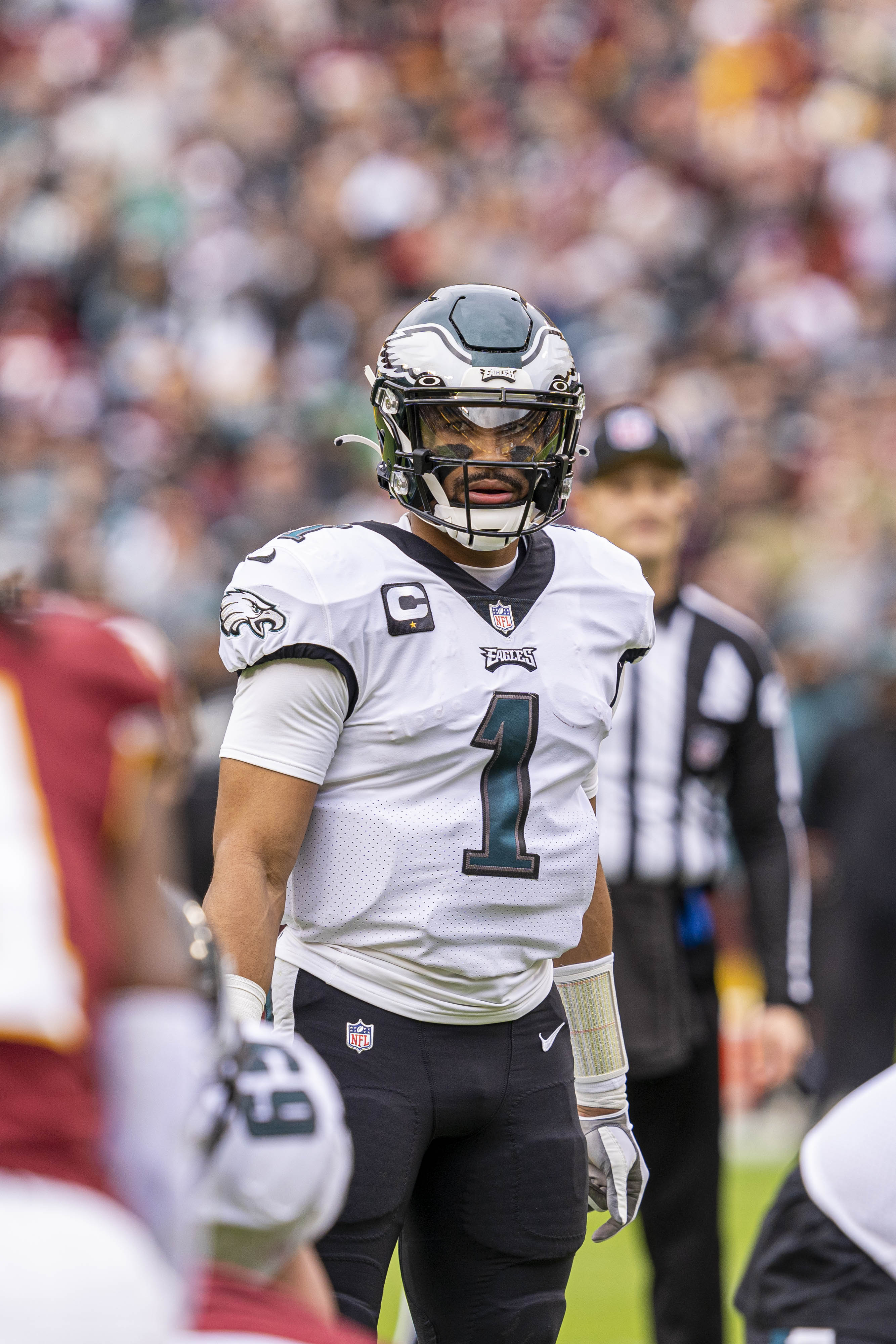 Eagles Jalen Hurts injury — quarterback Jalen Hurts on the field in his white away uniform in 2022