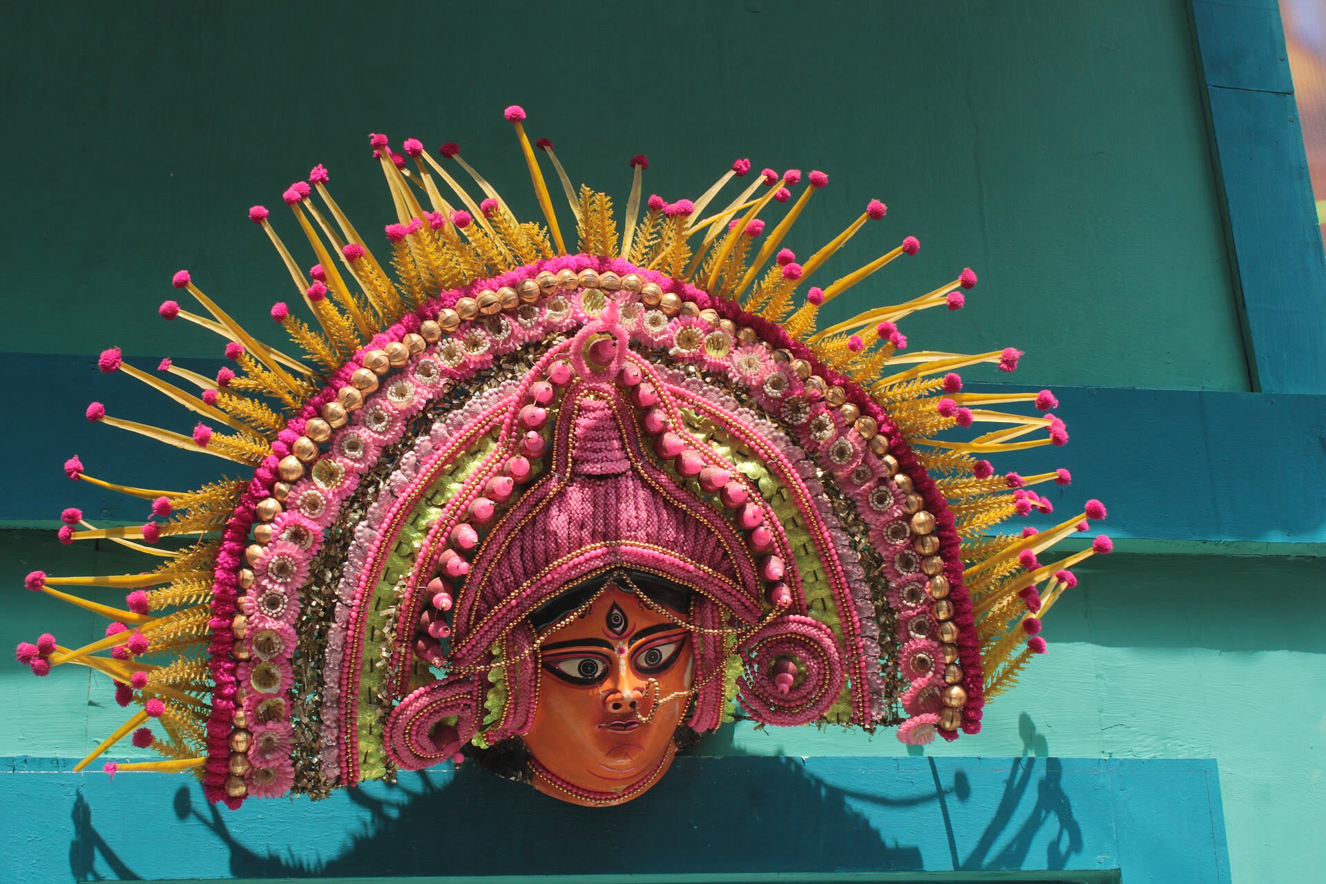 Ornate Durga face artwork decorating a Kolkata Durga Puja pandal in 2025