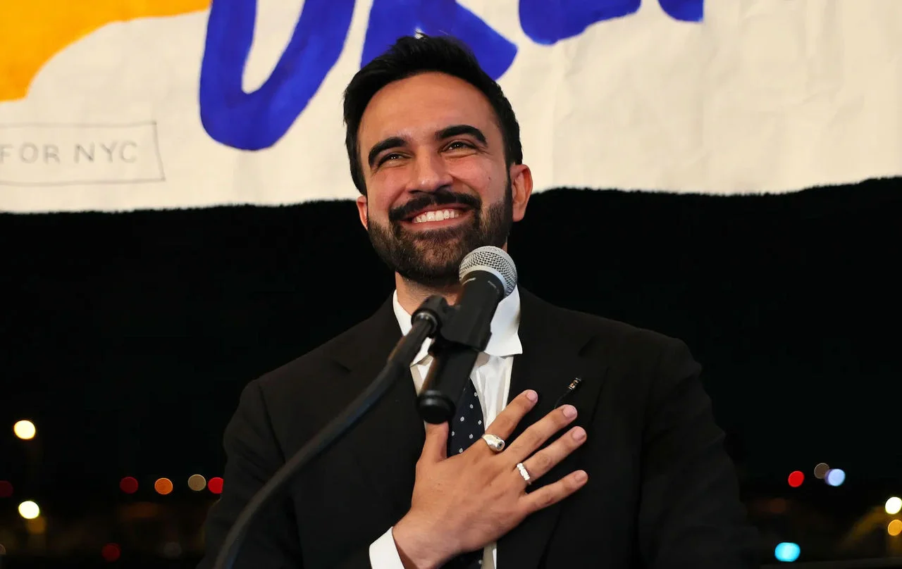 New York City Mayor Zohran Mamdani speaking at a microphone