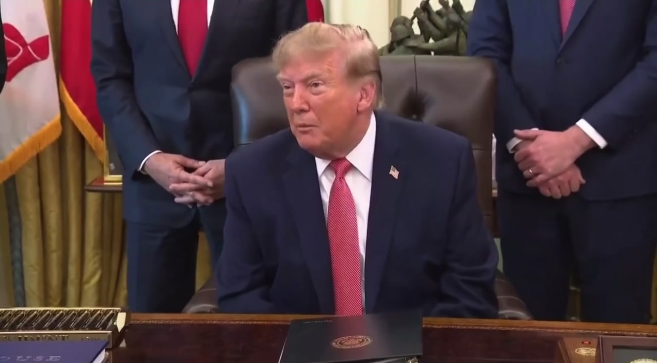 President Donald Trump gesturing while speaking about Minnesota during the October 20 Oval Office event