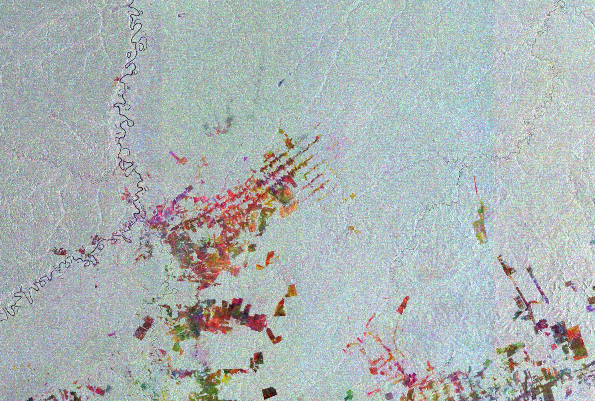 Satellite radar image of Boca do Acre in western Brazil showing geometric deforestation plots cut along roads in the Amazon