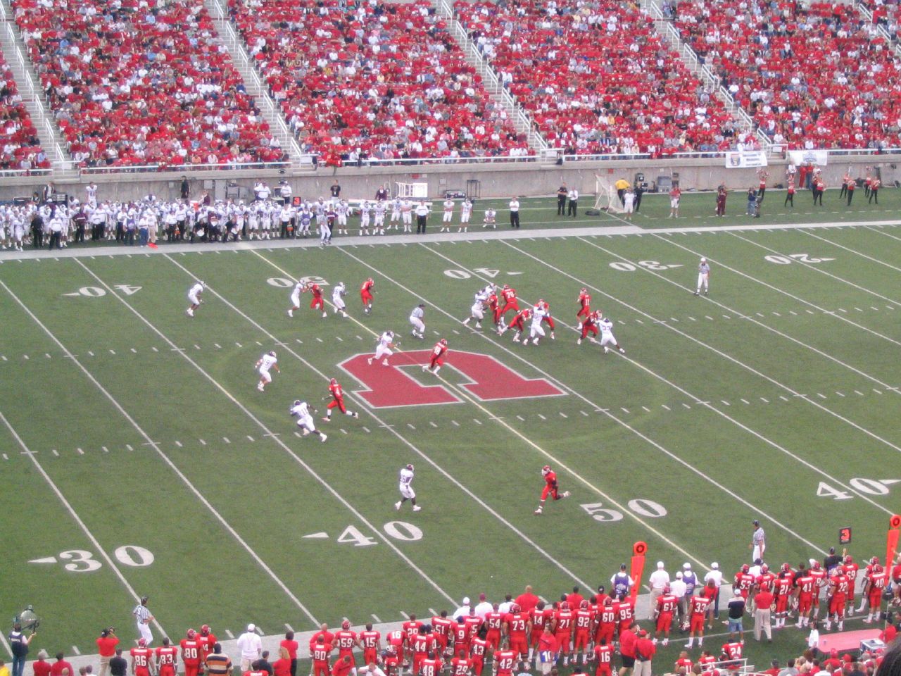 Utah Utes quarterback throwing a pass at Rice-Eccles Stadium in Salt Lake City