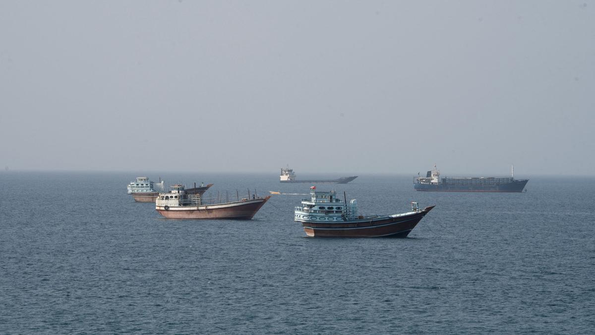 Commercial vessels moving through the Strait of Hormuz as seen from Musandam, Oman, in July 2026