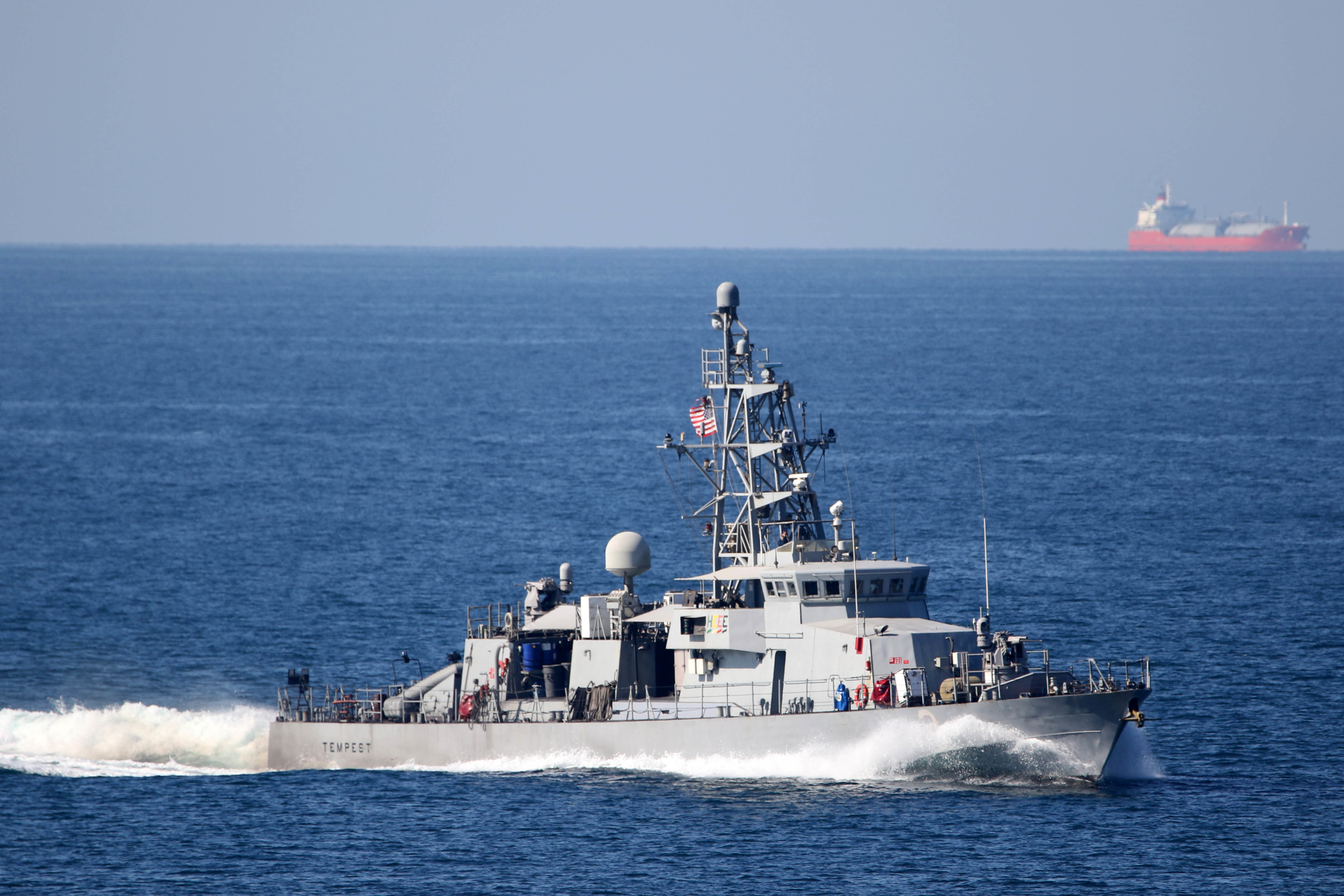 A U.S. Navy patrol ship transiting the Strait of Hormuz, where small-craft attacks on tankers are rising