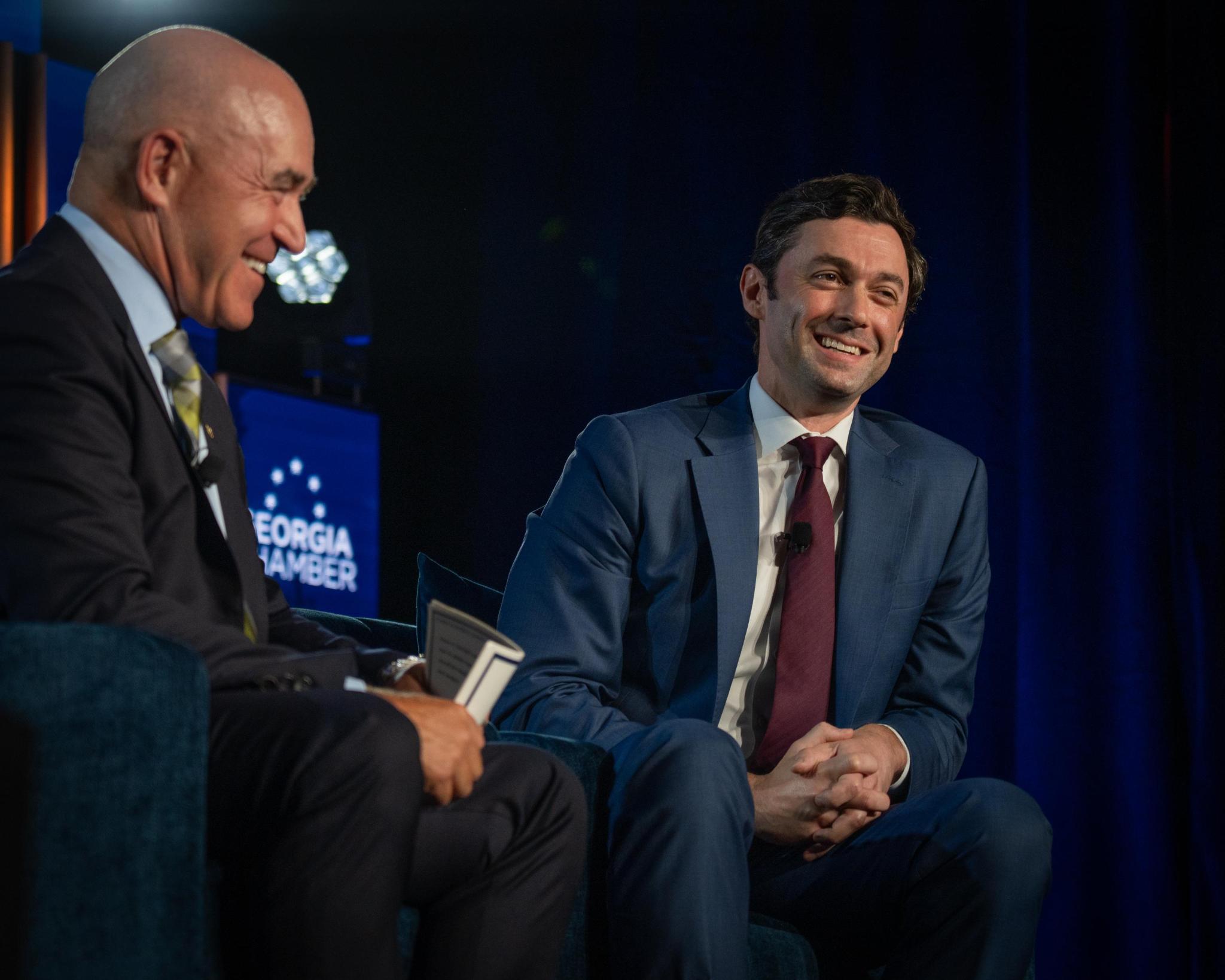 Senator Jon Ossoff smiling during a Georgia Chamber of Commerce event in August 2025