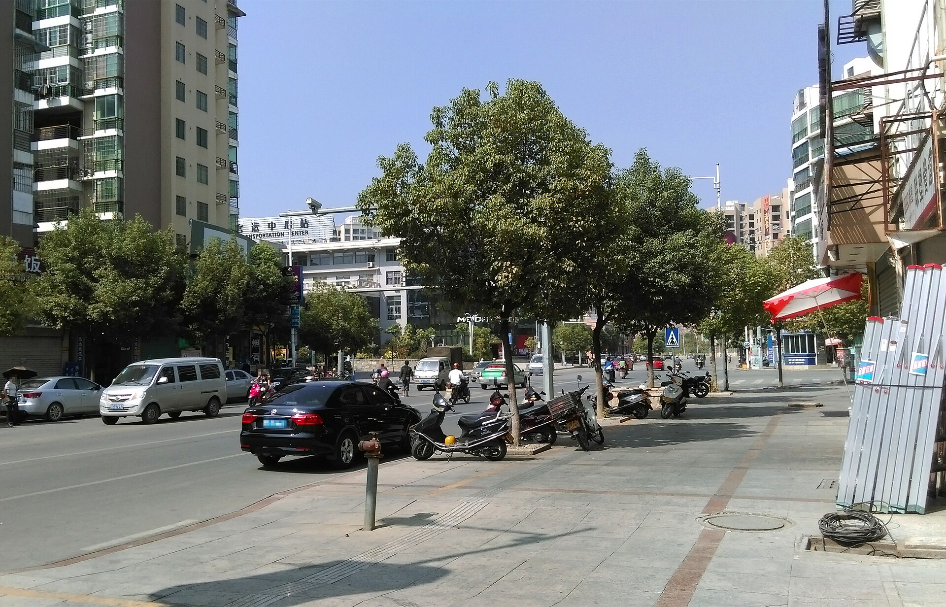 Street and residential buildings in Zhangping Fujian China, toddler window rescue context
