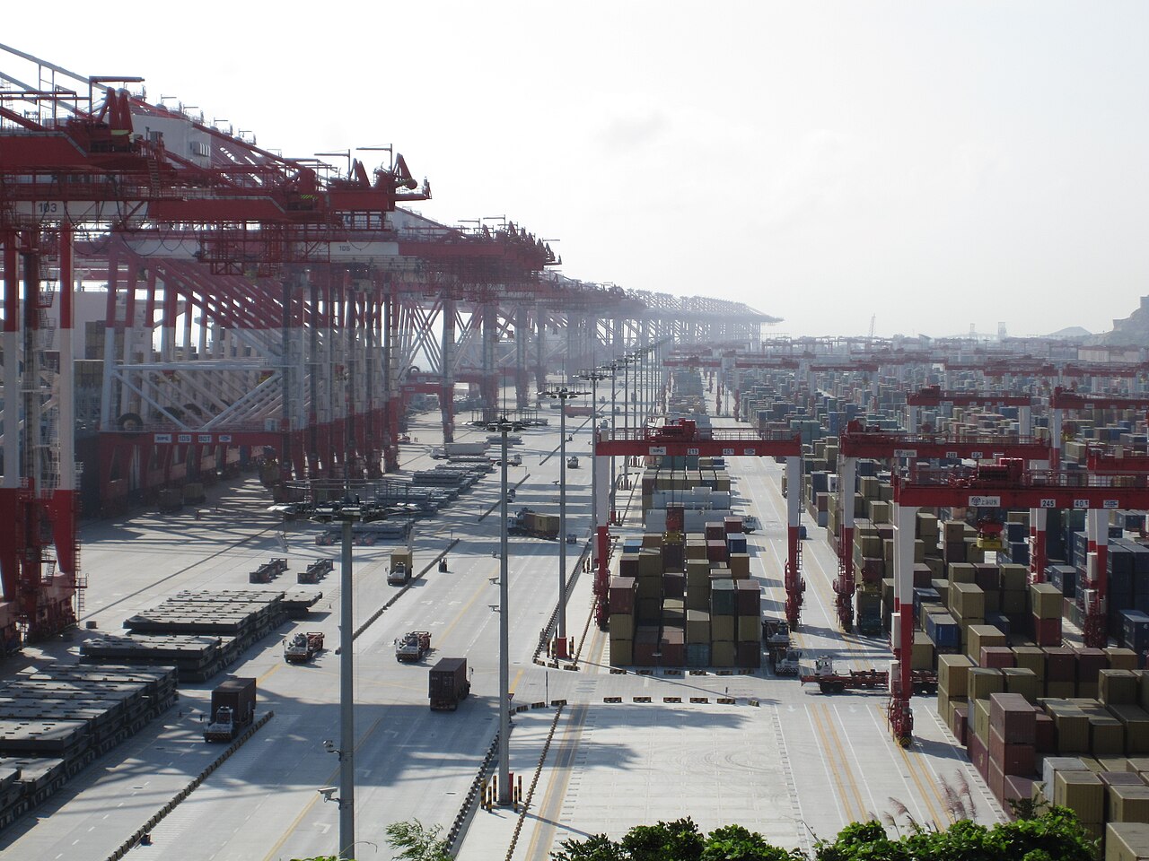 Container stacks at Yangshan deep-water port in Shanghai, a hub for the exports covered by China AI export controls October 2026