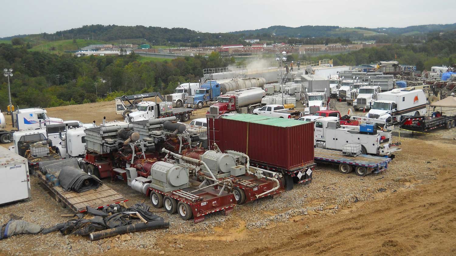 Hydraulic fracturing equipment and trucks on a Marcellus Shale gas pad in Appalachia, the basin at the centre of the EQT Range Resources merger