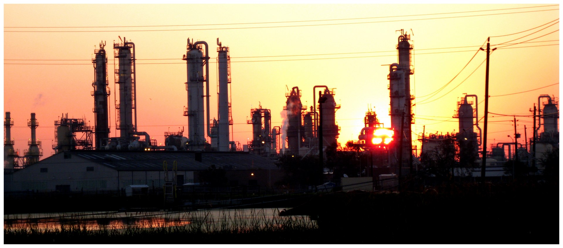 The Baytown refinery in Texas at sunrise — file photo for stock market today October 26 2026 as oil prices ease on diplomacy