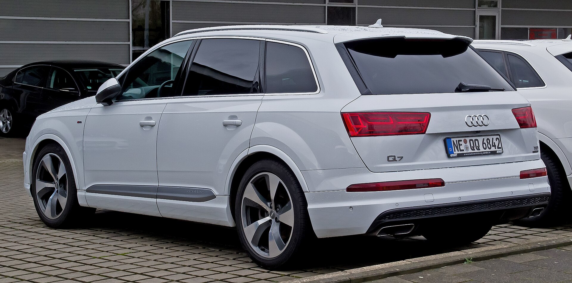 A white Audi Q7 3.0 TDI quattro S line photographed in Düsseldorf, Germany — the Q7 is one of three large SUVs Audi plans to build at the Georgia plant