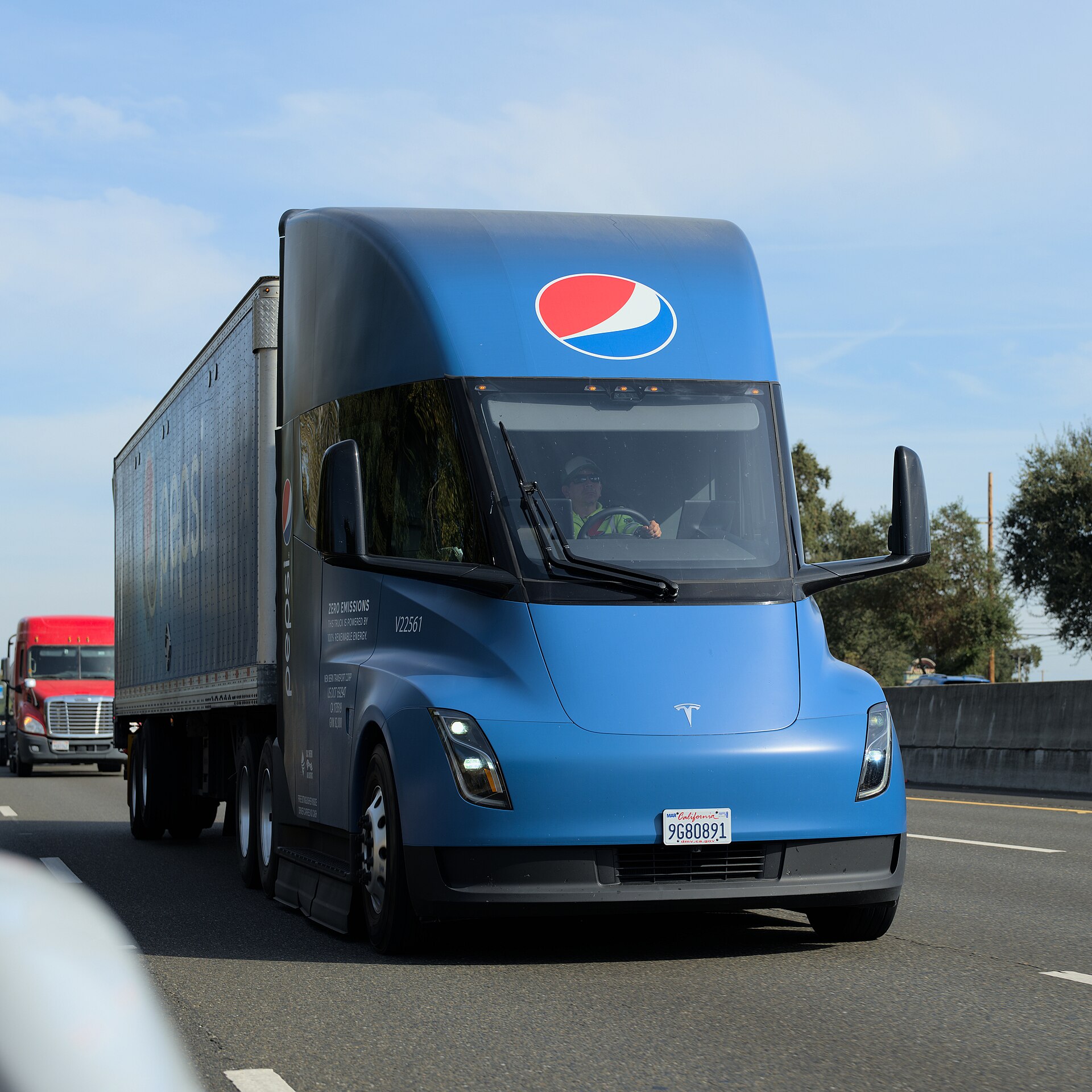 A Tesla Semi in PepsiCo livery on a California highway — Tesla said volume production of the Semi has begun in Nevada