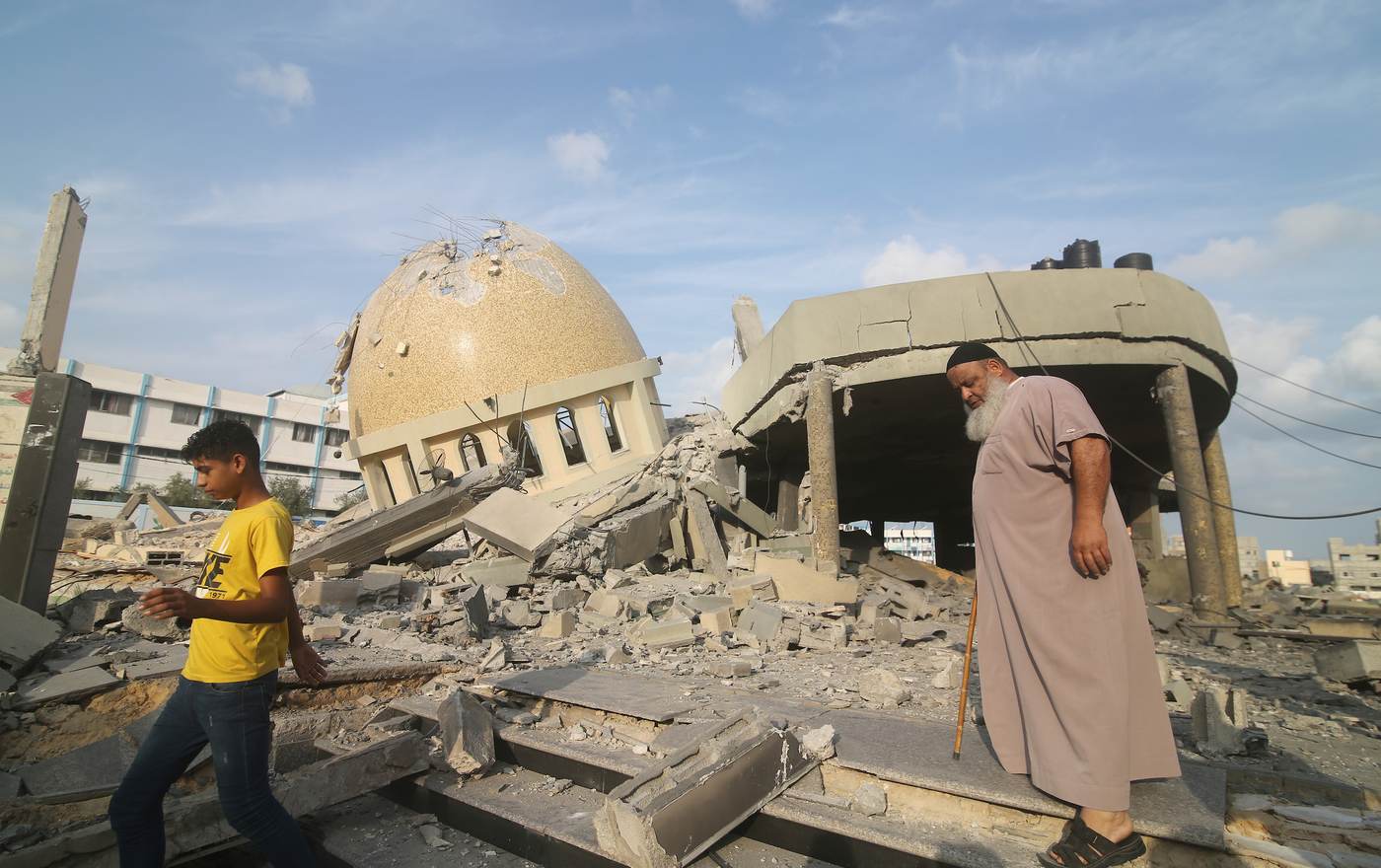 Palestinians inspect ruins in Khan Younis in a file photograph illustrating the Gaza war’s destruction