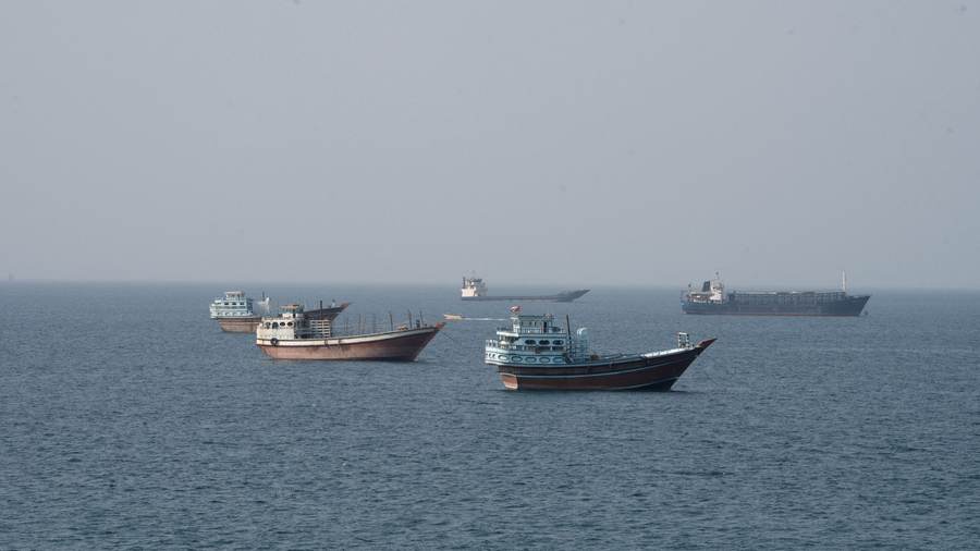 Commercial vessels moving through the Strait of Hormuz as seen from Musandam, Oman, in July 2026
