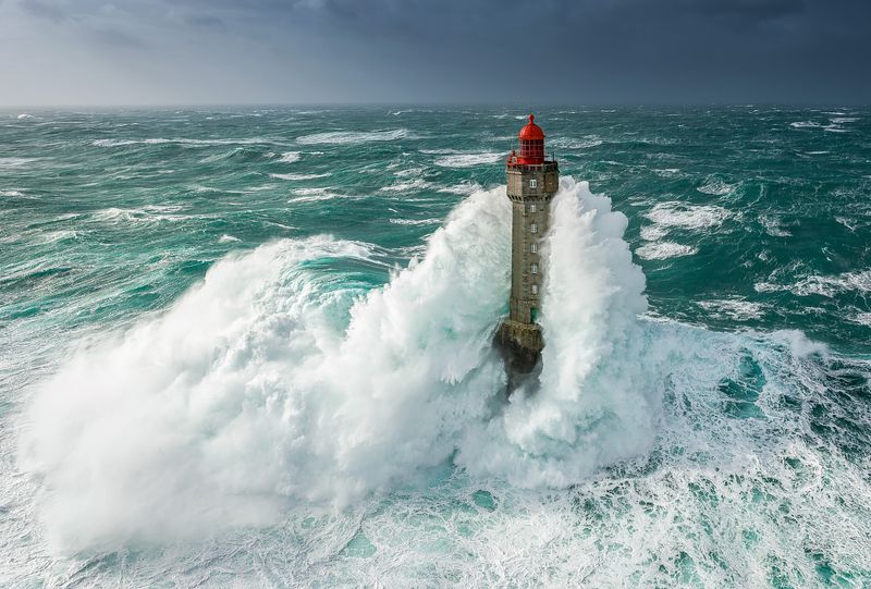 Storm Austen power cuts — a huge wave engulfs La Jument lighthouse off Ouessant in Brittany, France, in storm seas