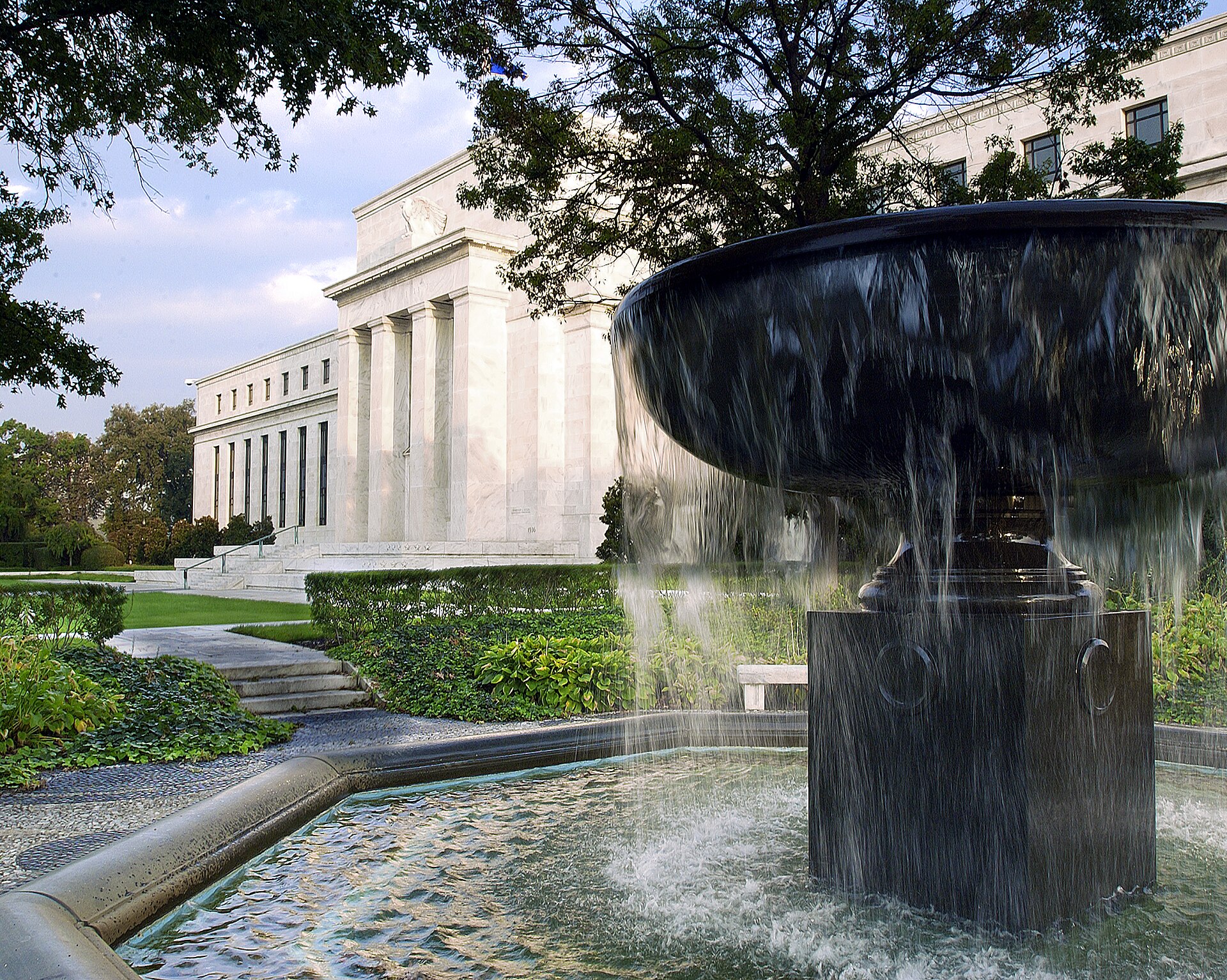 The Federal Reserve's Eccles Building in Washington, D.C., seen past a fountain on its grounds (file photo) — the Fed held rates steady at the October 28, 2026 market close