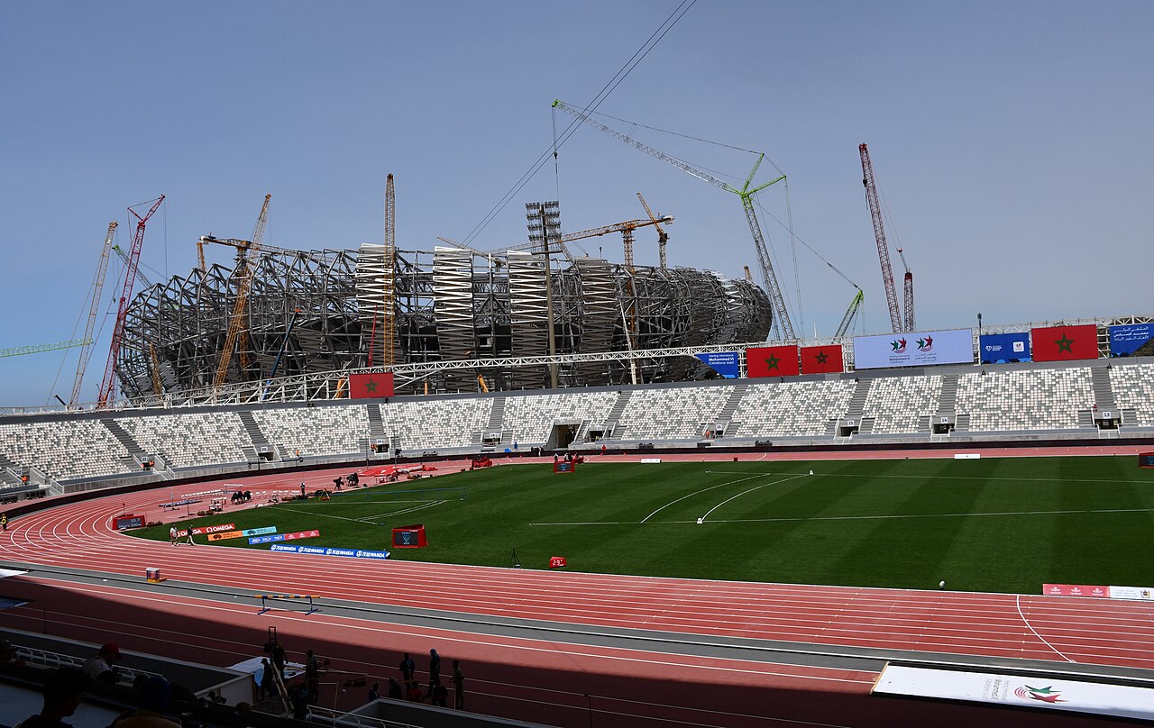 Rabat Olympic Stadium with construction cranes behind it during Morocco's preparations for the 2030 World Cup