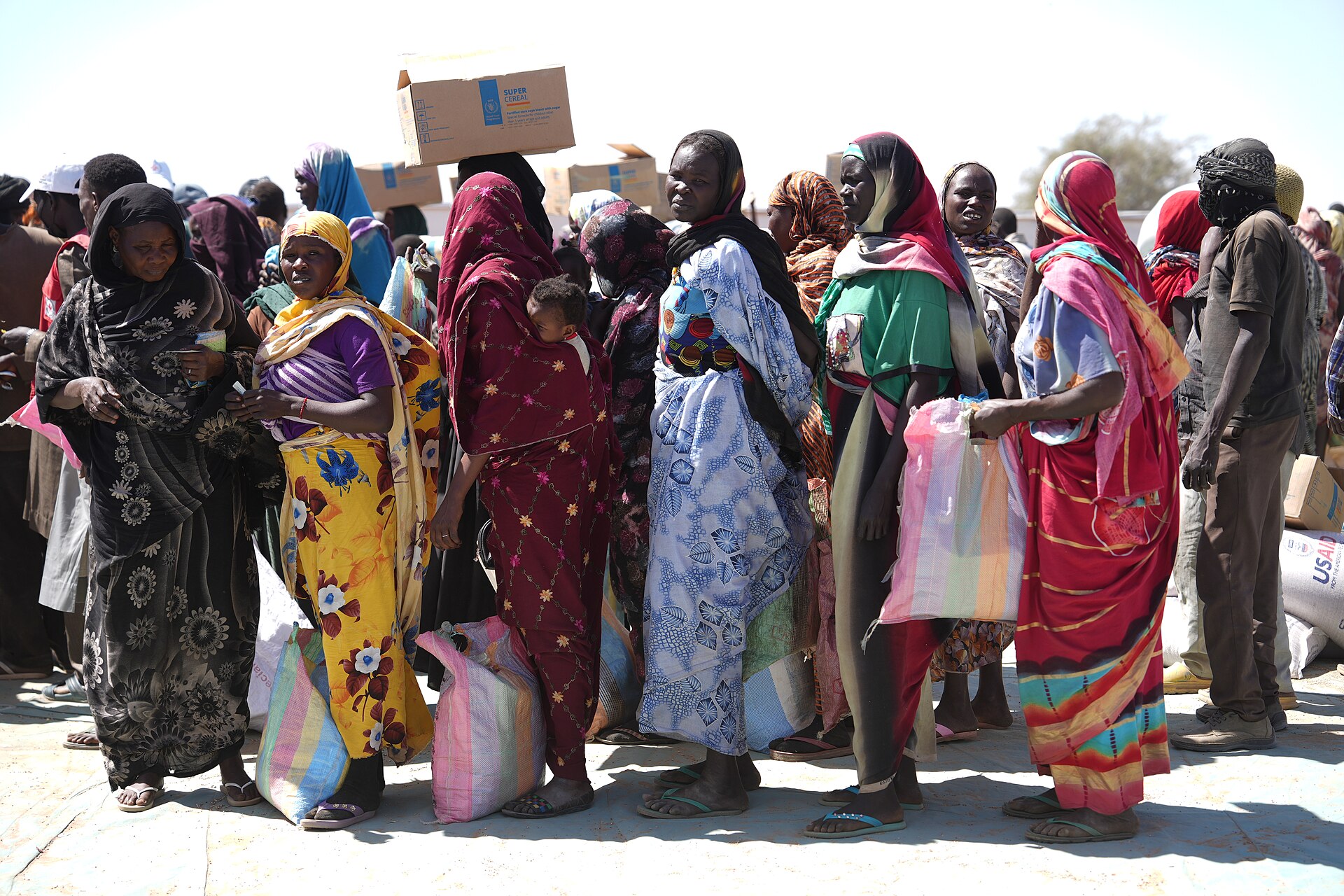 Sudanese refugee women queueing for food aid at Adre in Chad, near the border with Sudan