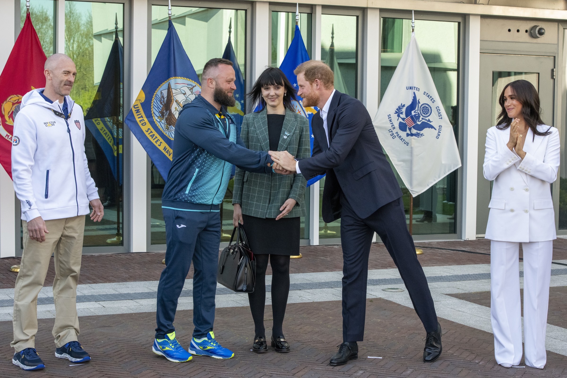 Prince Harry and Meghan at a US Embassy welcome event for the Invictus Games in The Hague, with Meghan who says she kept her father Thomas Markle away from her children to protect them