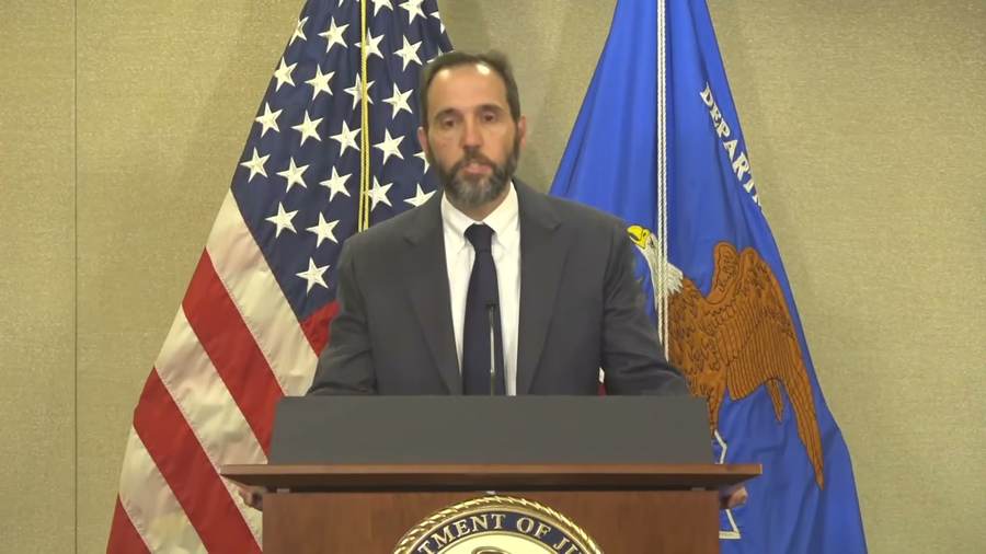 Former special counsel Jack Smith speaks at a Justice Department podium — frame from official DOJ video