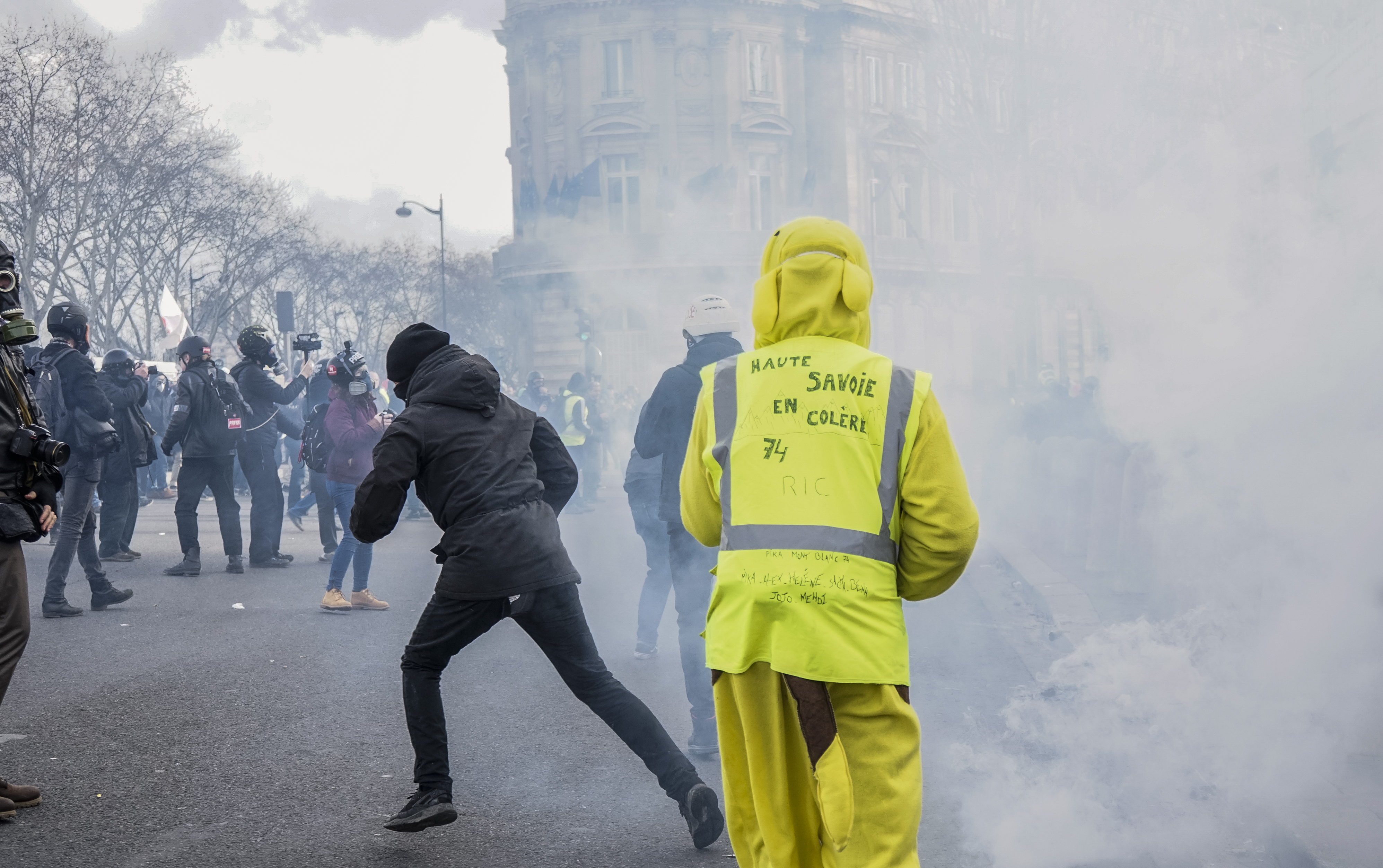 Yellow Vests protesters in Paris amid tear gas in February 2019, the original movement whose name and tactics have returned in France's October 2026 demonstrations