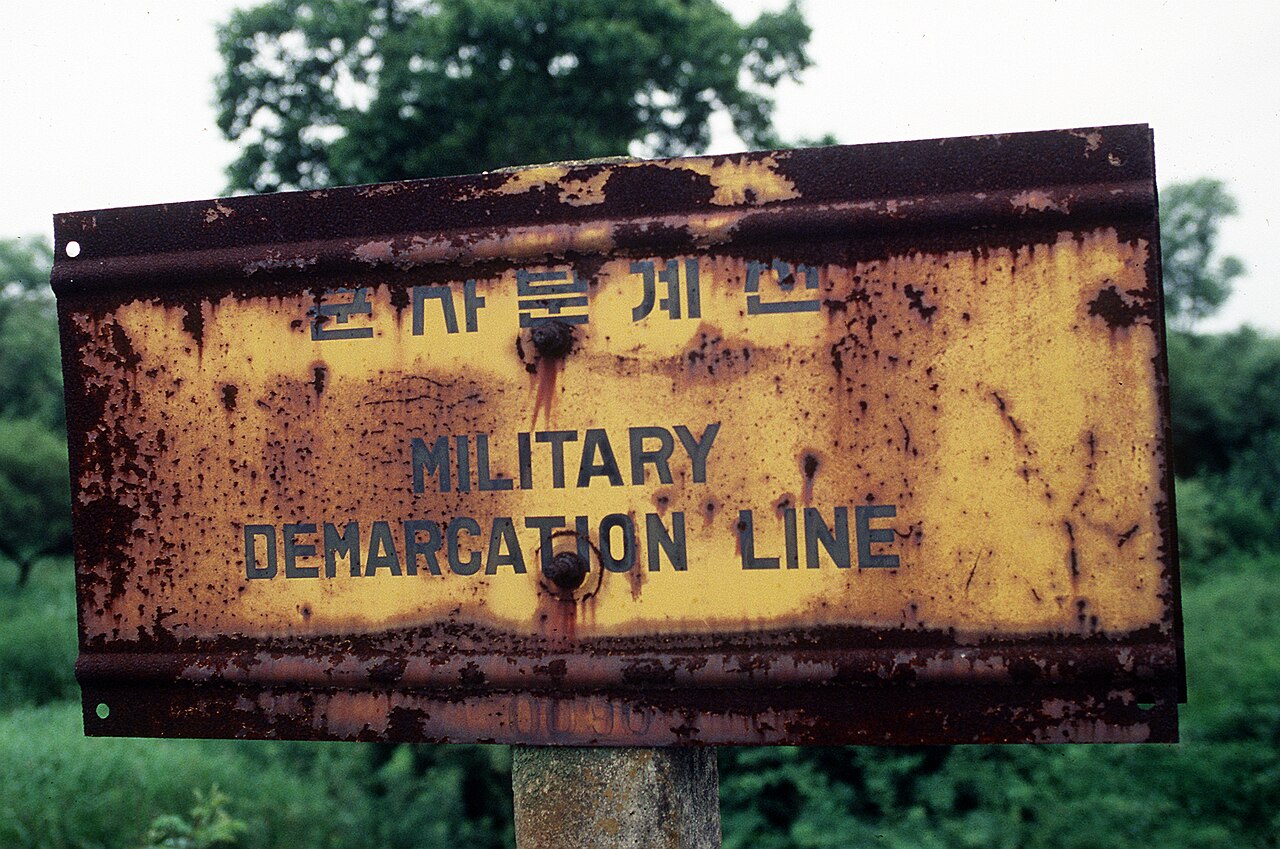 Military Demarcation Line sign illustrating mapping gaps central to the North Korea DMZ mines apology dispute
