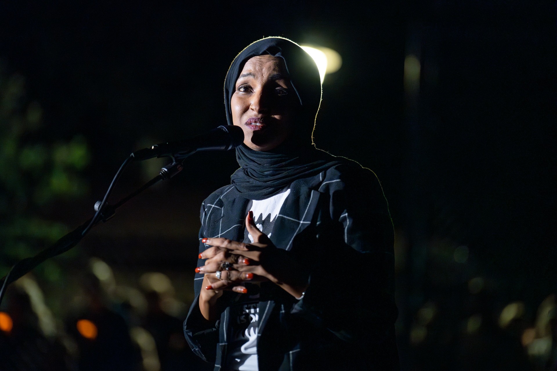Rep. Ilhan Omar speaking at an evening vigil in Minneapolis in August 2025 — file photo