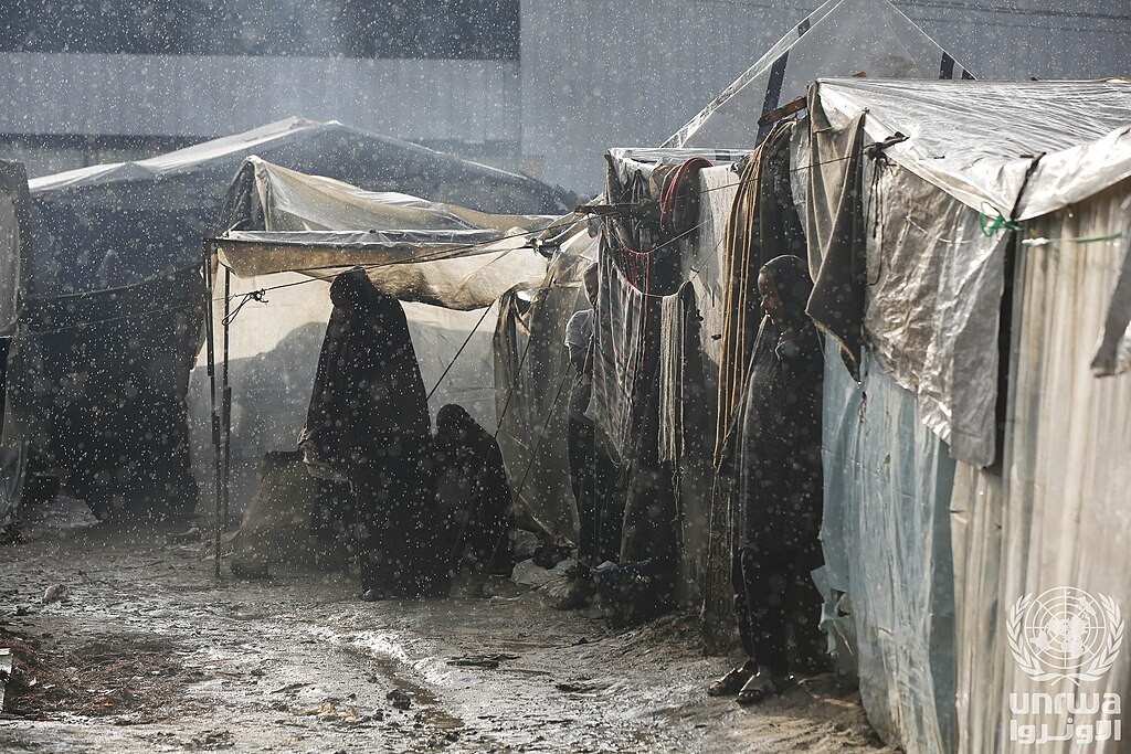 Flooded tents of displaced Palestinians after heavy rain in Deir el-Balah, Gaza — the winter flood risk the UN envoy warned the Security Council about