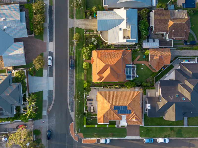 Australian homes — the RBA's 2026 tightening has cut typical borrowing capacity by about $90,000 while house prices have declined in most capital cities