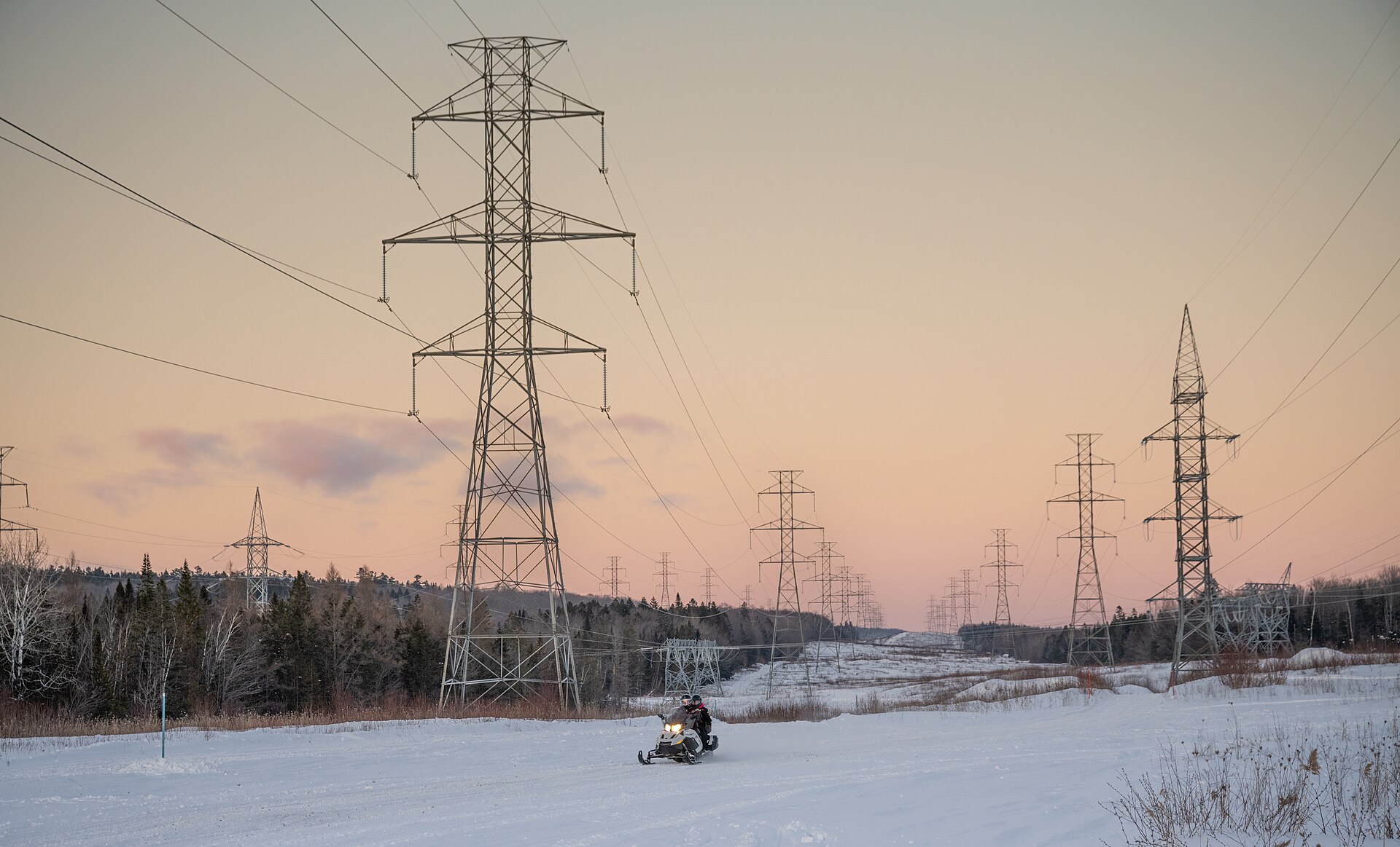 Electricity transmission pylons at sunset