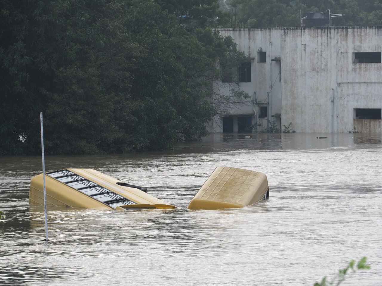 Floodwater around a partly submerged bus in Chennai in 2015, illustrating the danger from extreme urban rainfall