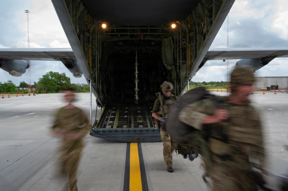 Royal Danish Air Force protection personnel exiting a C-130J at Karup Air Base during a 2026 NATO exercise