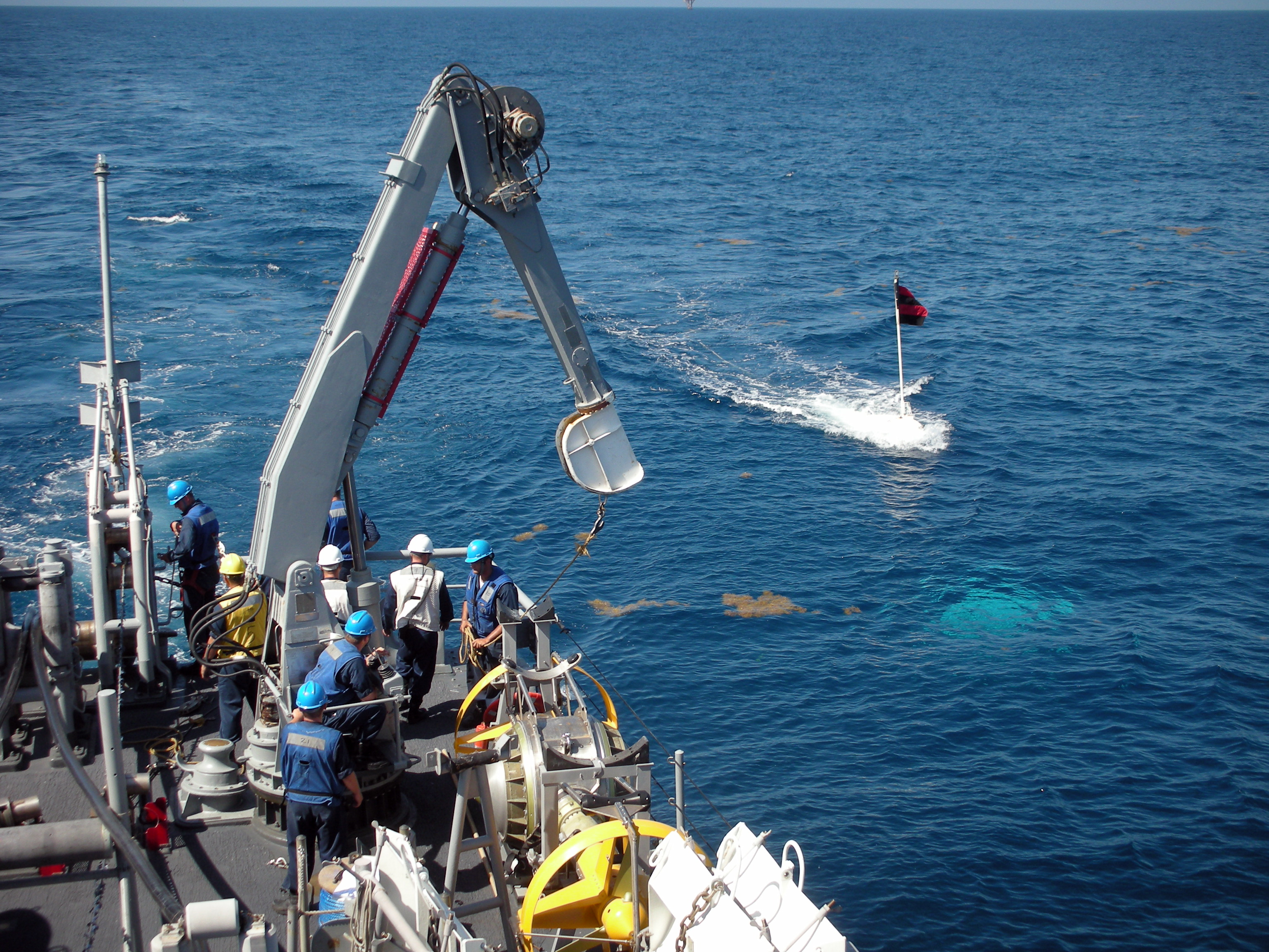 A mine countermeasures ship at sea, in a file photograph illustrating the naval mine threat behind the tankers hit mines Hormuz reports
