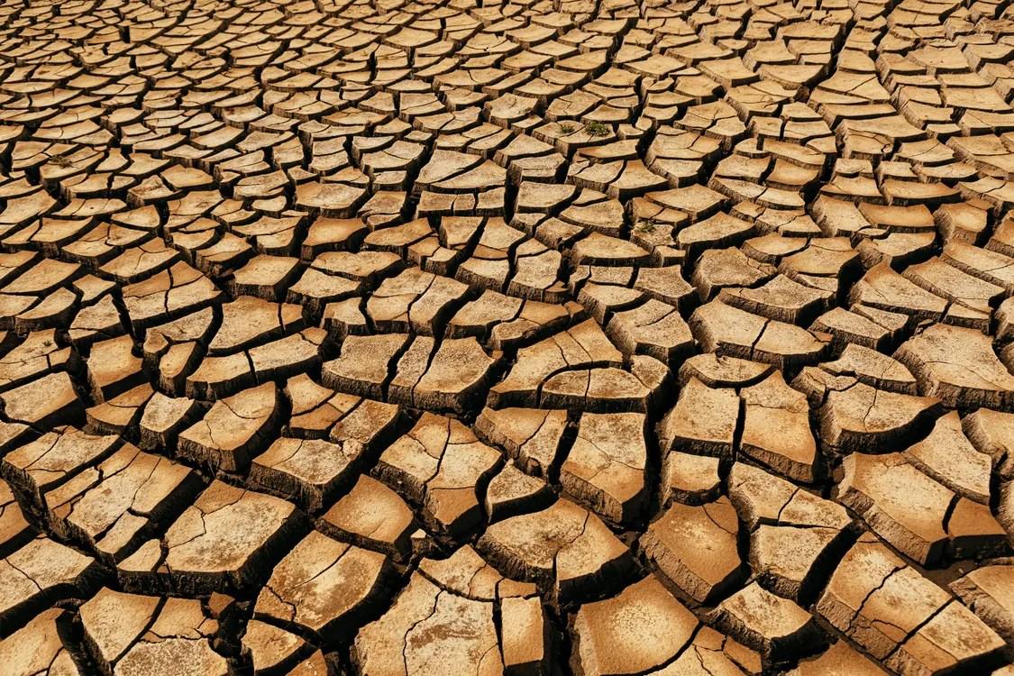 Cracked, parched earth illustrating prolonged rainfall failure