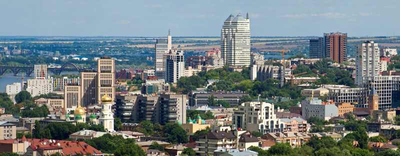 Dnipro city skyline near transport and industrial districts after a reported industrial facility strike