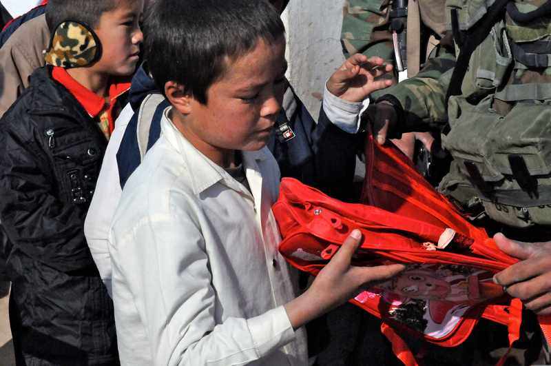 An Afghan student receives supplies during a humanitarian assistance mission in Herat, Afghanistan — one of 12 crises in the UN's $160 million CERF allocation