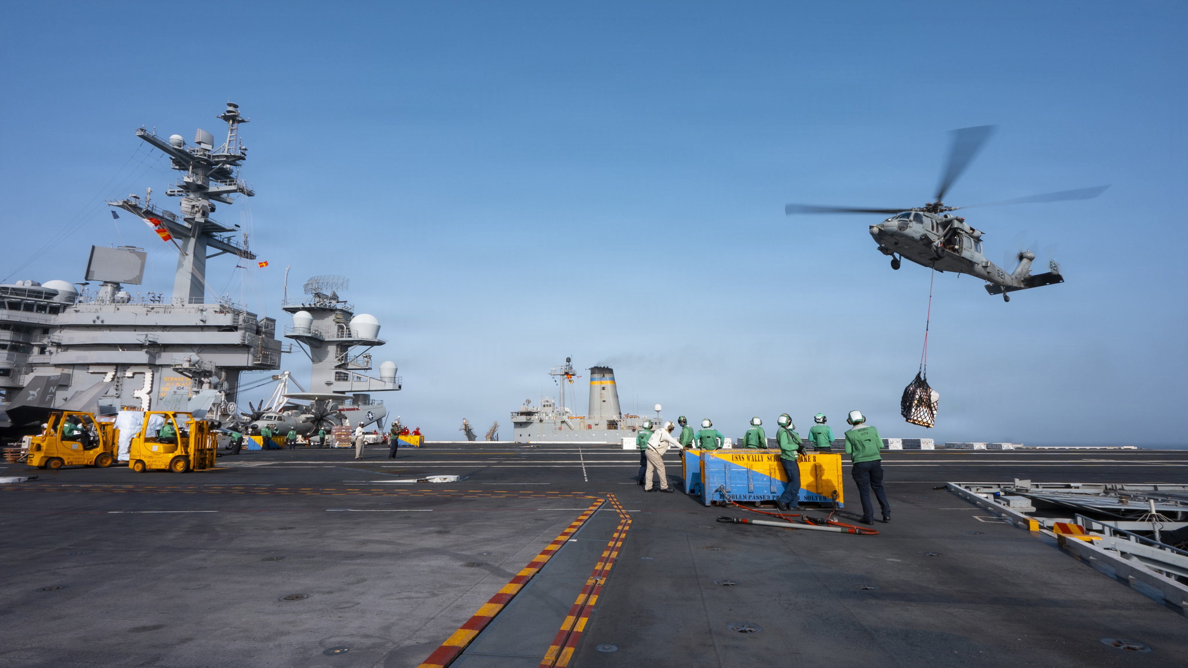 USS George Washington taking on supplies in the Arabian Sea with the US Fifth Fleet, the carrier the Journal says is loading munitions